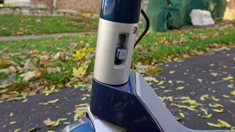 The hinge’s locking mechanism securely holds the handlebars in place.
